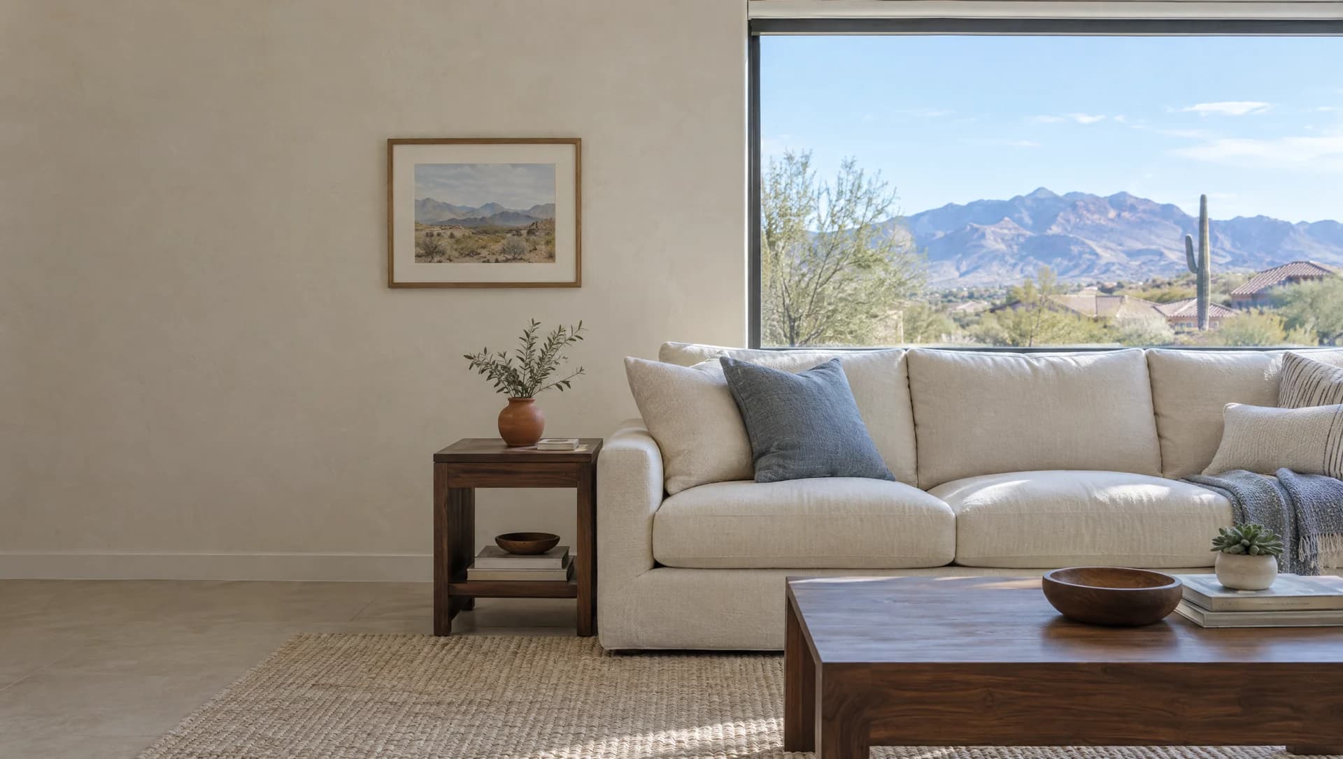 Illustrative sunlit Arizona living room with a comfortable linen sofa and desert views